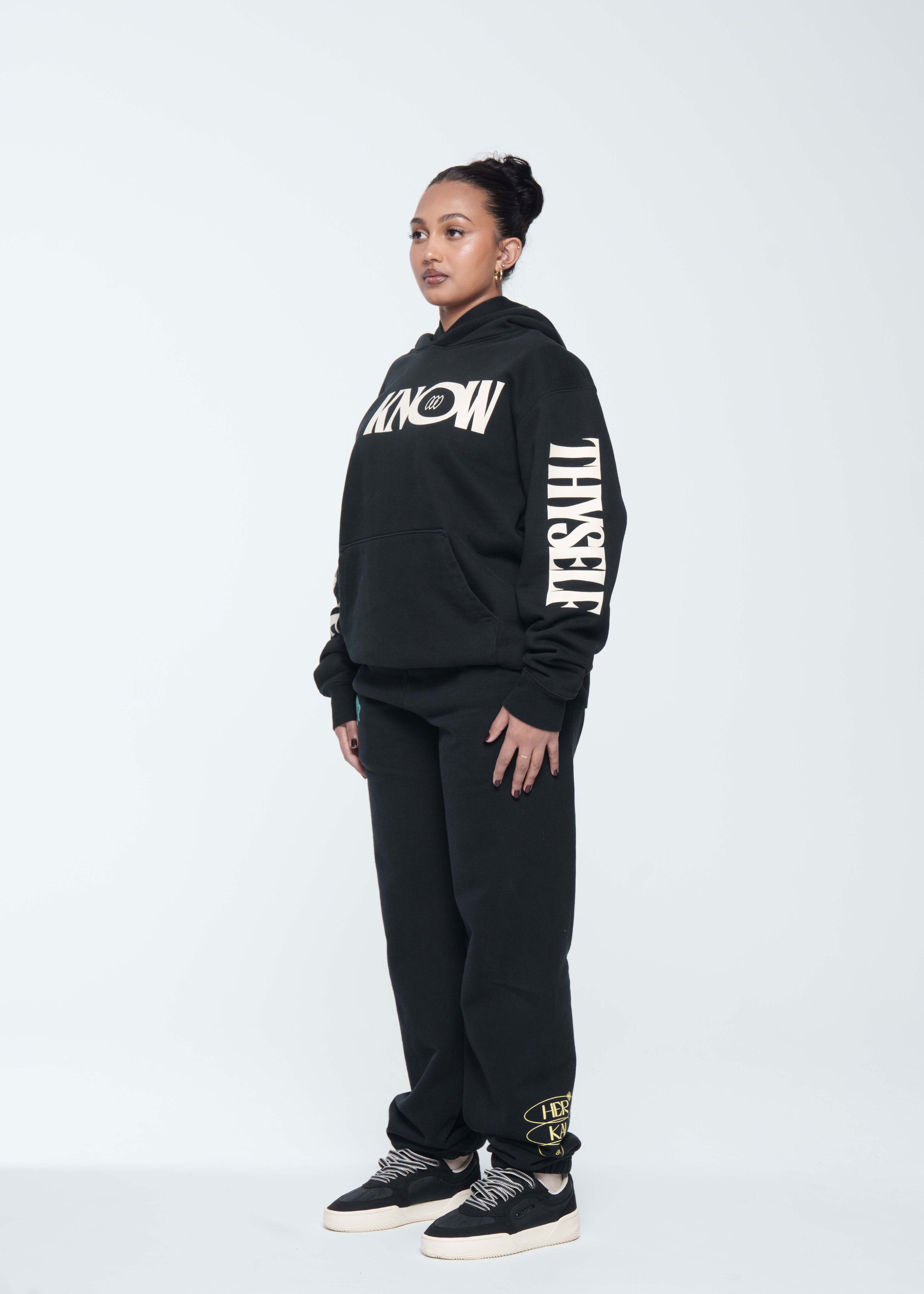 Model is wearing size Medium in Know Love Hoodie in Black by Her Kai & I