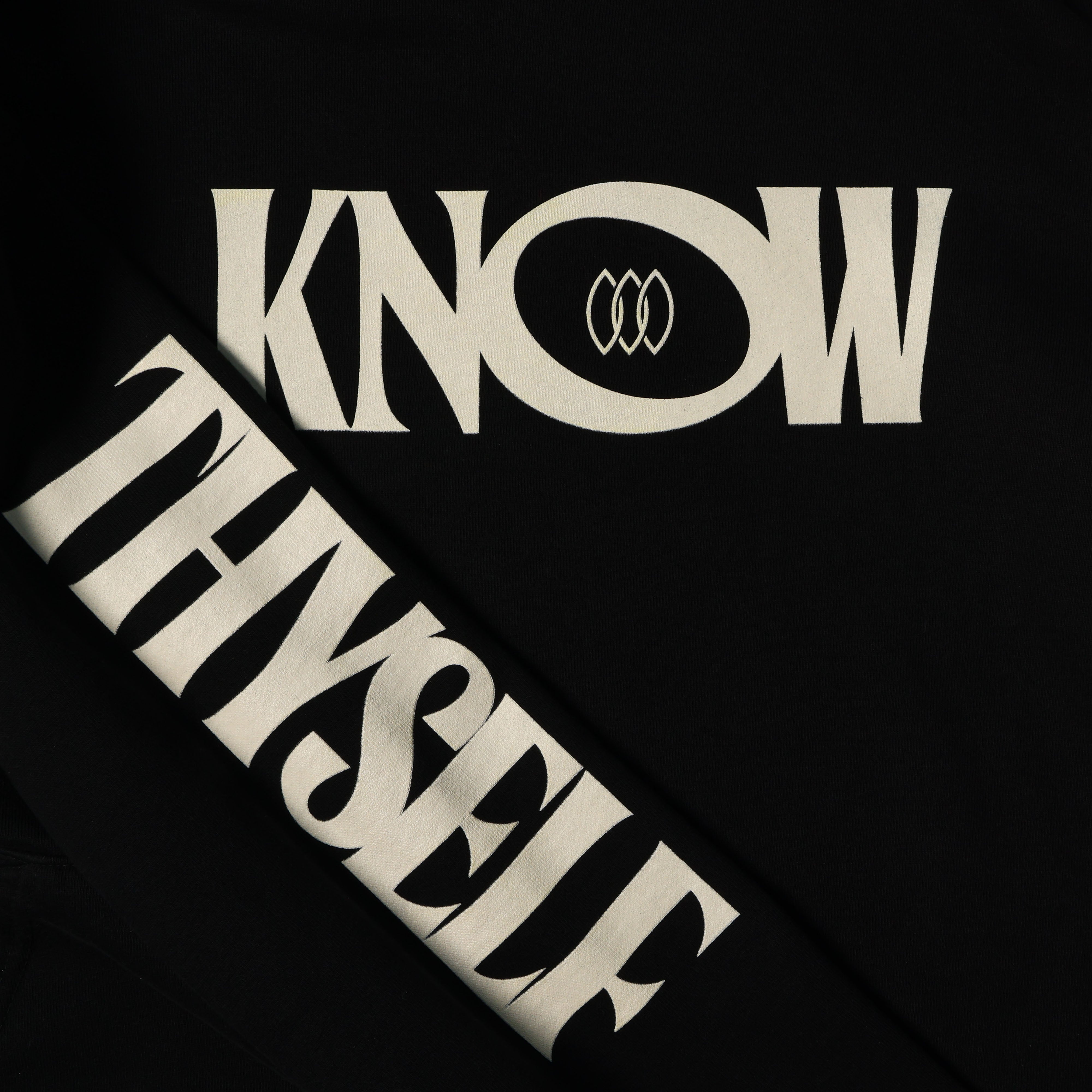 Detail view of graphic text on Know Love Hoodie by Her Kai & I in Black